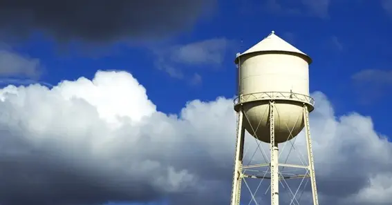 water towers store water above the level of consumers for times of heave use eliminating the need fo